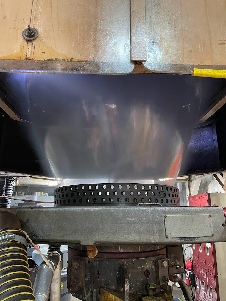 Blown film extrusion bubble showing film cooling and bubble formation above the air ring.